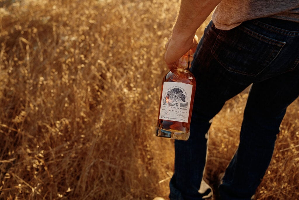 Brother's Bond Bourbon in a corn field