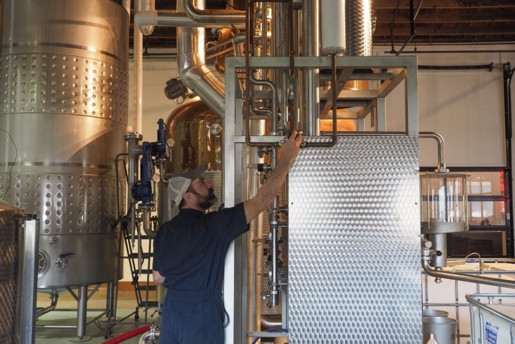 A distiller making spirits