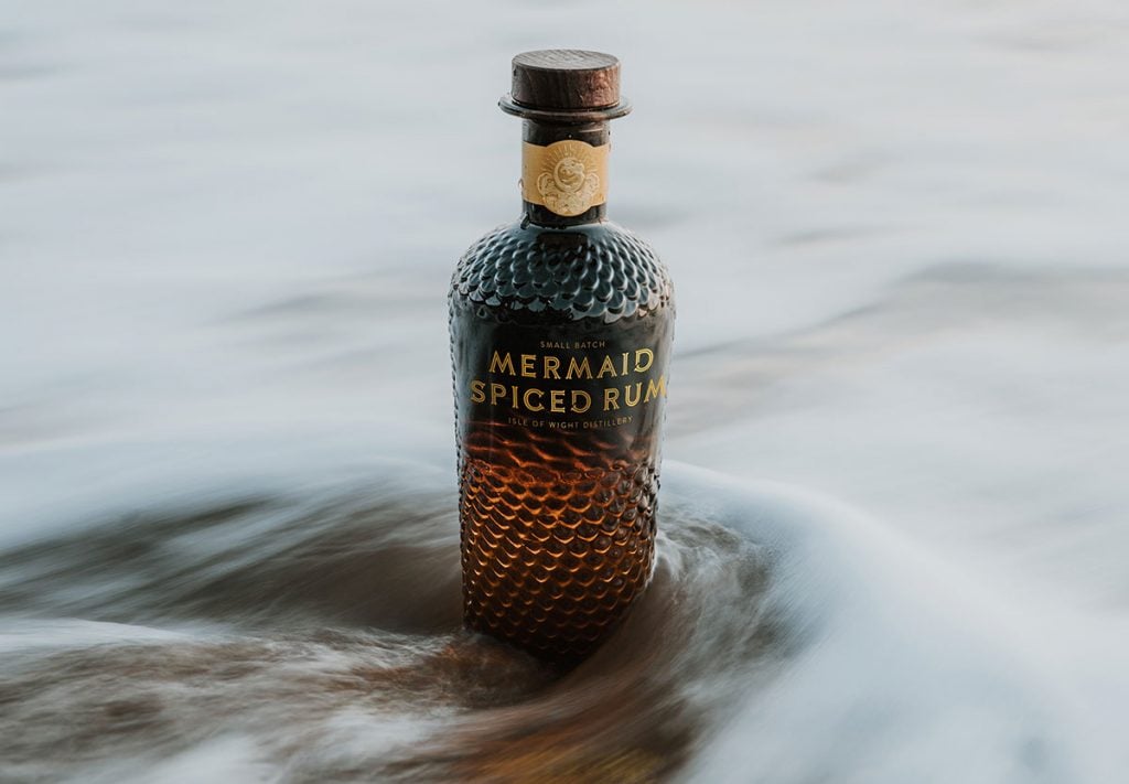 A bottle of Mermaid Spiced Rum in the ocean